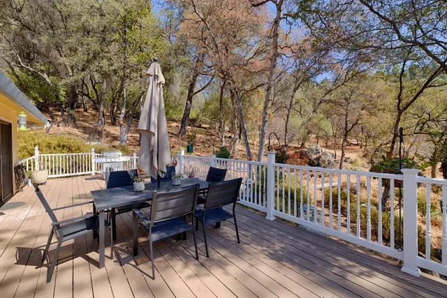a view of a patio with table and chairs and couches
