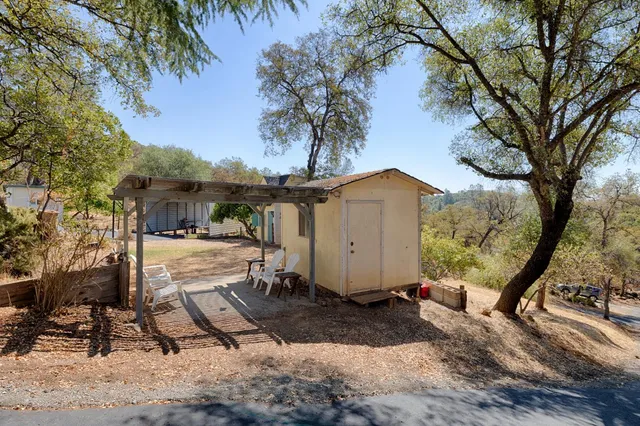 a view of a street with trees in front of it