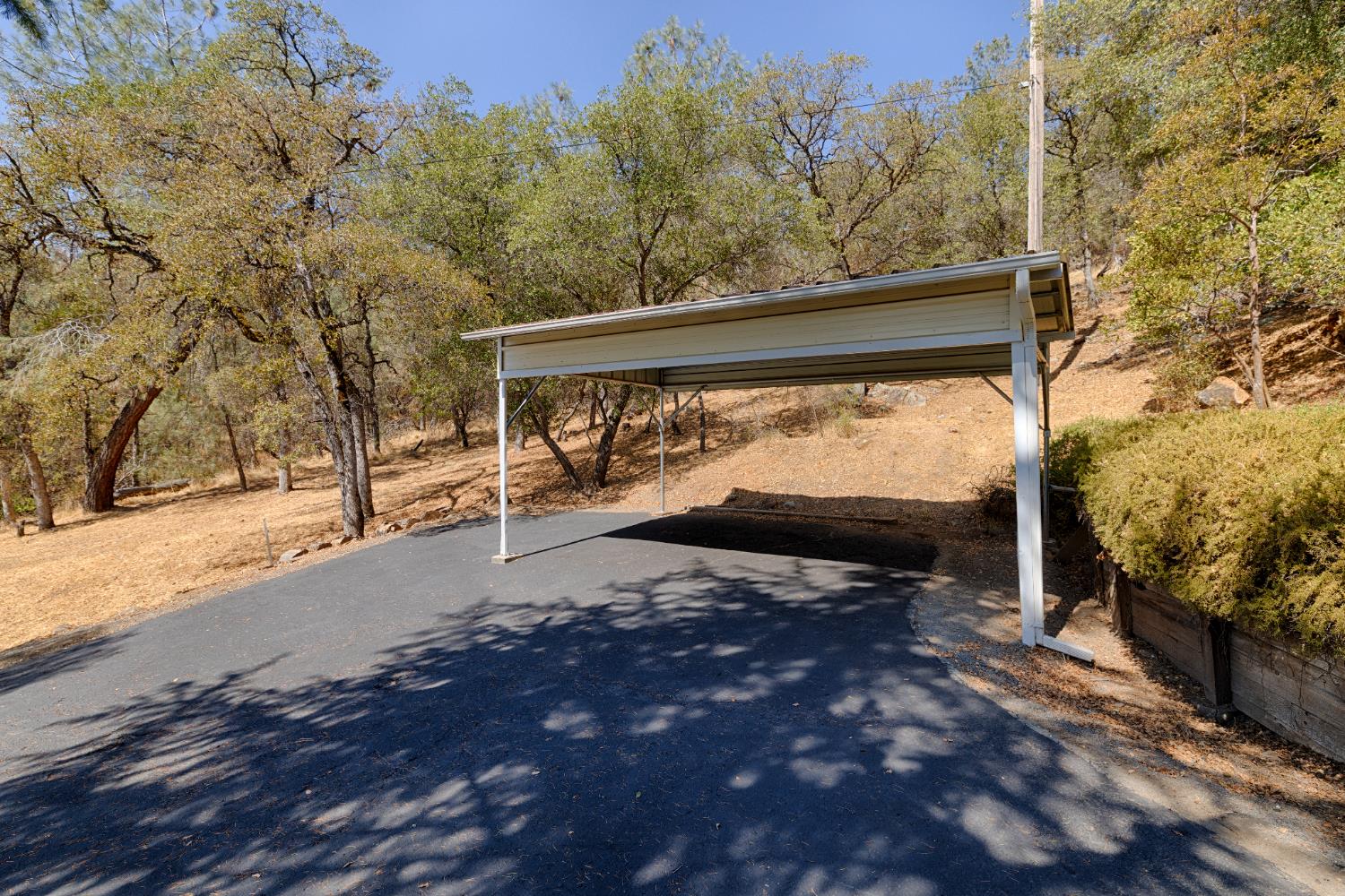 14580 McElroy Road Auburn, CA 95602 - Photo 44 of 48 a view of a street with trees in front of it