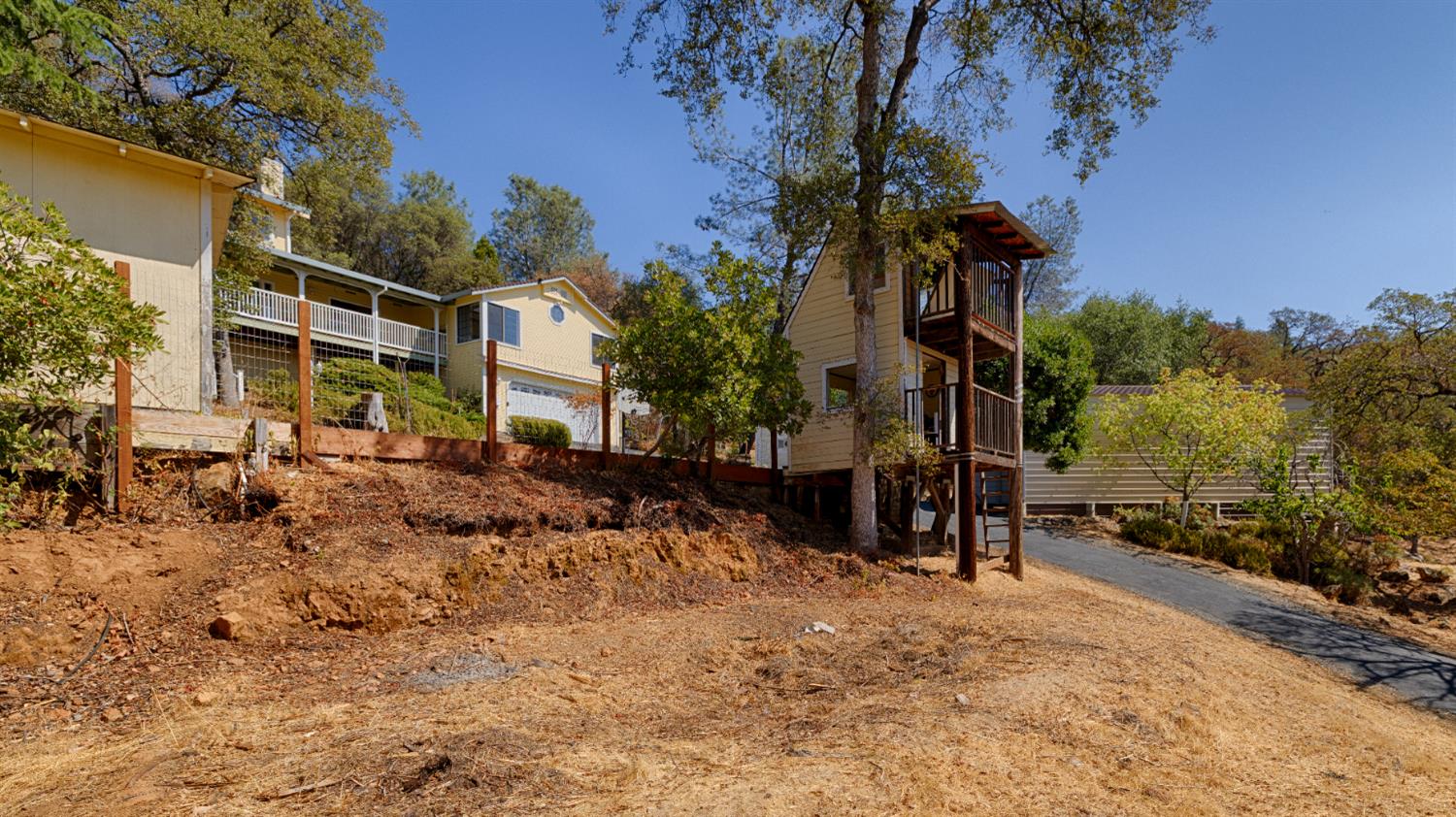 14580 McElroy Road Auburn, CA 95602 - Photo 45 of 48 a view of a house with a backyard