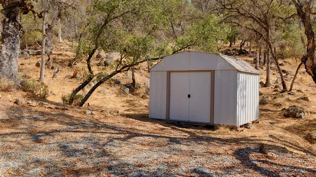 a view of a balcony with wooden floor