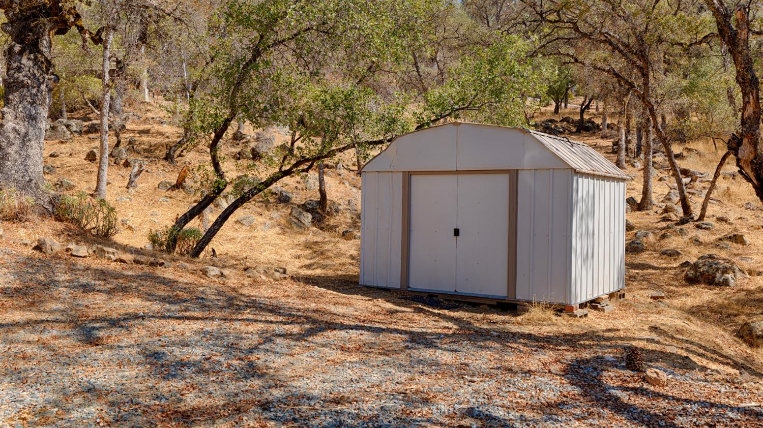 14580 McElroy Road Auburn, CA 95602 - Photo 46 of 48 a house with trees in front of it