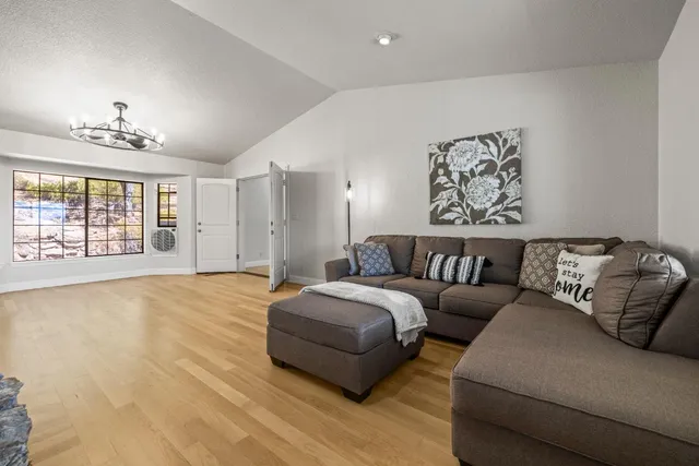 a spacious bedroom with a bed and a couch