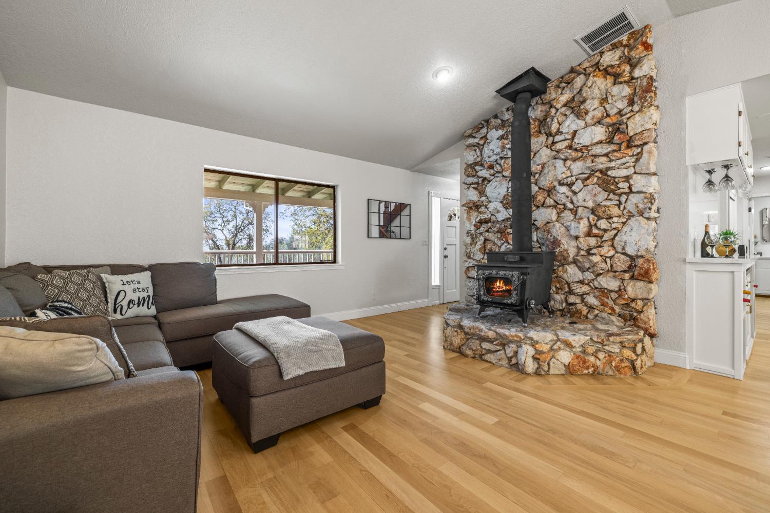 14580 McElroy Road Auburn, CA 95602 - Photo 8 of 48 a living room with furniture and a fireplace