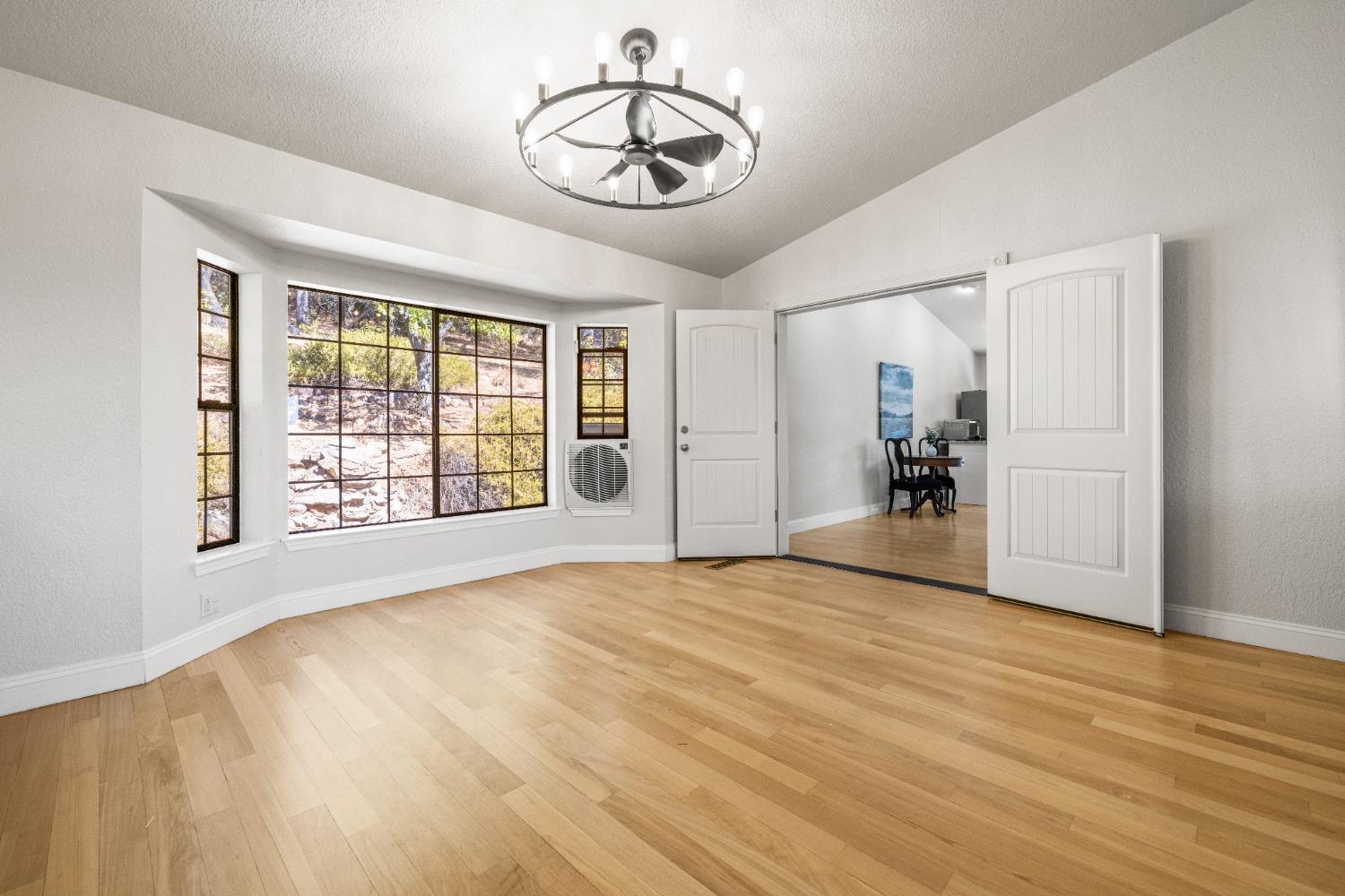 14580 McElroy Road Auburn, CA 95602 - Photo 10 of 48 a view of an empty room with a window