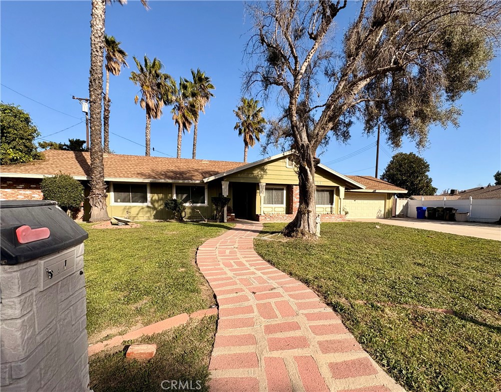5871 Geremander Avenue Rialto, CA 92377 - Photo 2 of 5 Front walkway, private mailbox and mature trees.