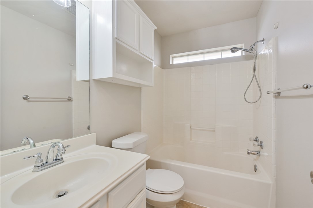 1804 Ibis Court Bryan, TX 77807 - Photo 12 of 17 a bathroom with a sink a toilet and shower