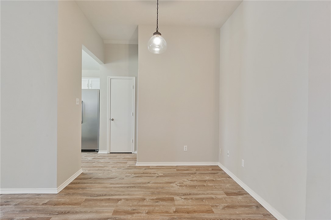 1804 Ibis Court Bryan, TX 77807 - Photo 6 of 17 a view of a room with wooden floor and white walls