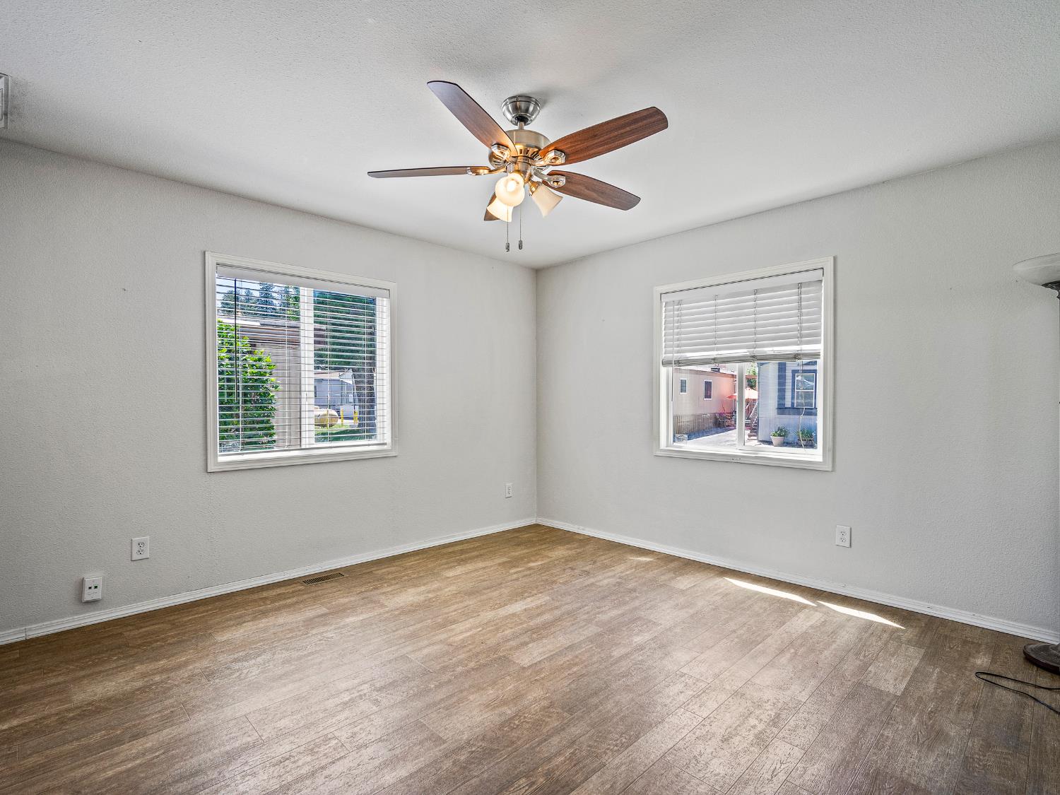 2933 Forebay Road, Unit 28 Pollock Pines, CA 95726 - Photo 12 of 26 a view of a workspace with wooden floor and windows