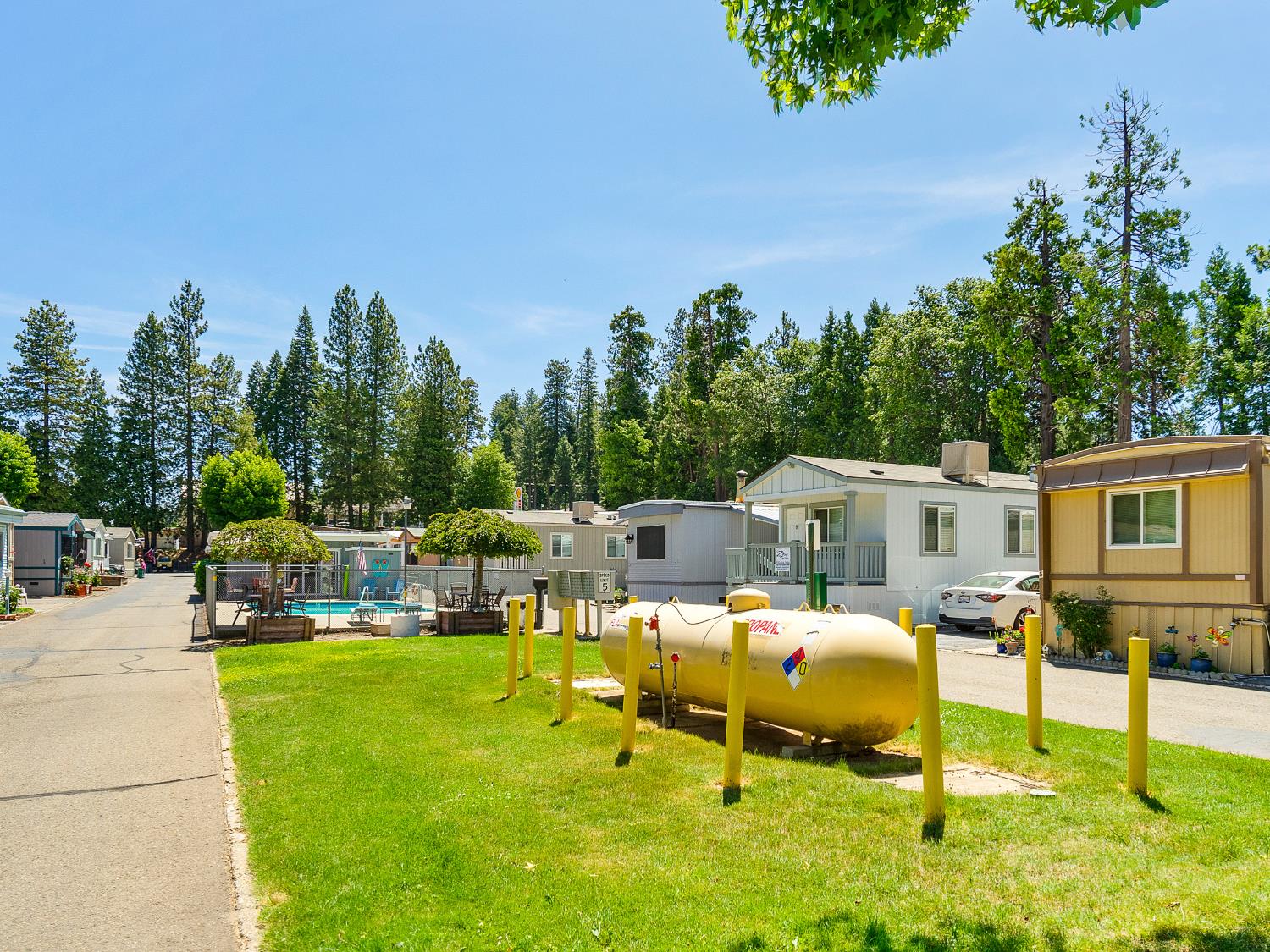 2933 Forebay Road, Unit 28 Pollock Pines, CA 95726 - Photo 22 of 26 a swimming pool with outdoor seating and yard
