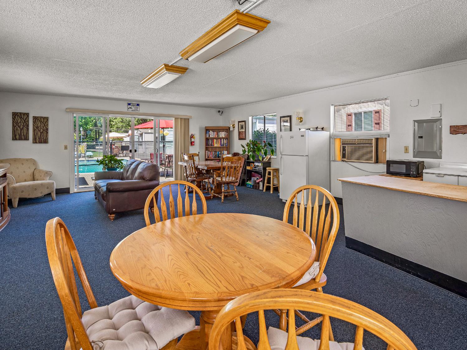 2933 Forebay Road, Unit 28 Pollock Pines, CA 95726 - Photo 24 of 26 a dining room with furniture a rug and wooden floor