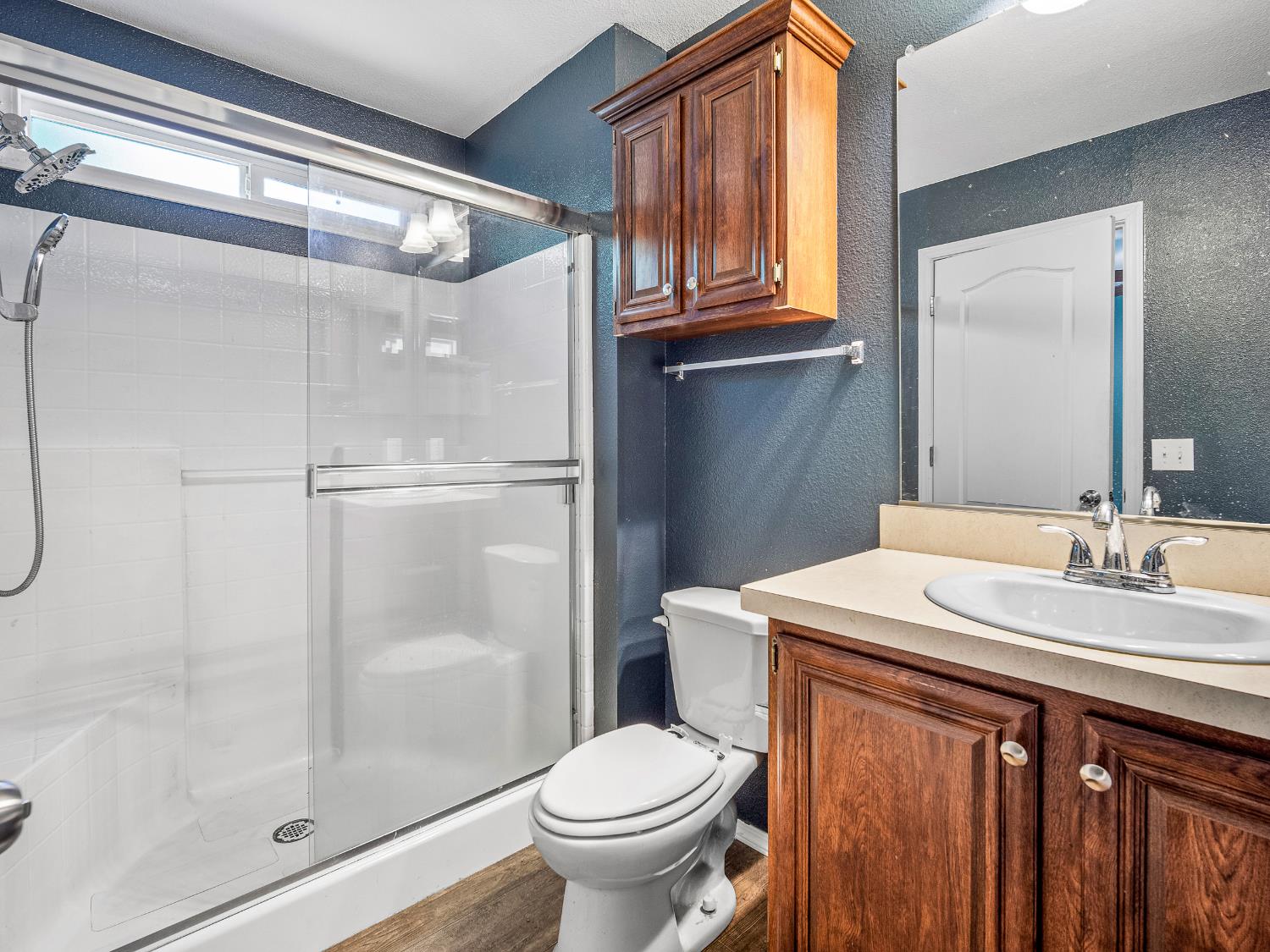 2933 Forebay Road, Unit 28 Pollock Pines, CA 95726 - Photo 7 of 26 a bathroom with a granite countertop sink toilet and shower