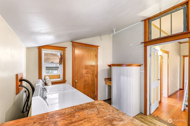 a bedroom with a bed next to a window with outer view