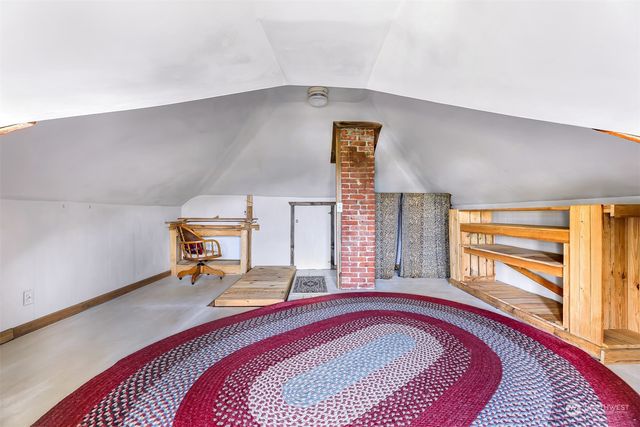 a bed room with a bed and a couch