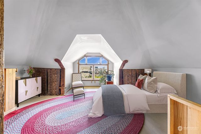 a bedroom with a bed and a couch