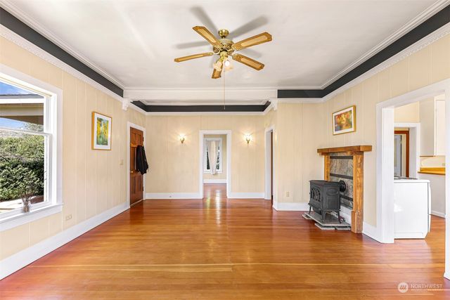 a view of an entryway with wooden floor