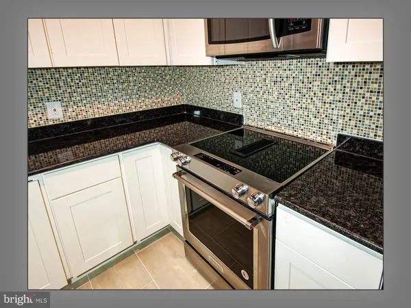 a close up of a stove top oven sitting inside of a kitchen
