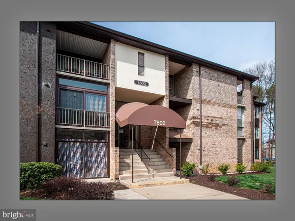 a front view of a building with street view