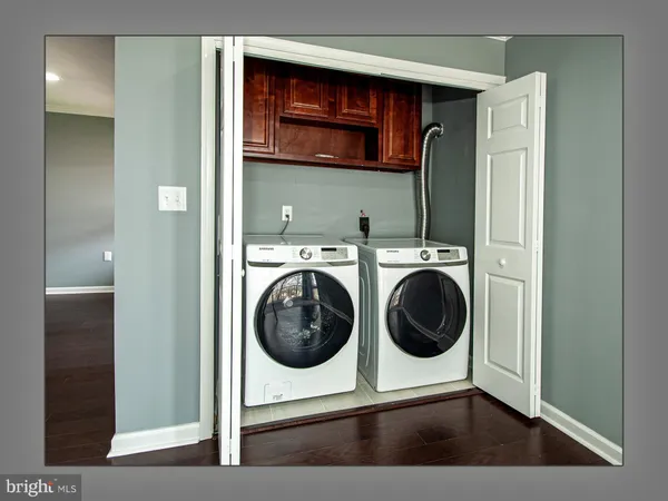 a view of a house with a yard fire pit and chair