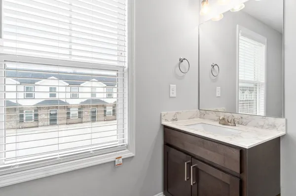 a bathroom with a sink and a mirror