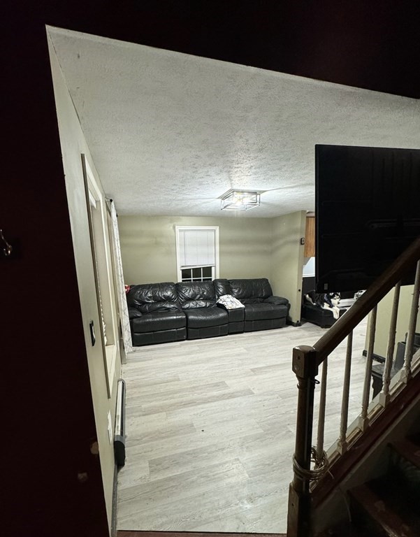 88 Lord Hill Road Rindge, NH 03461 - Photo 2 of 8 a view of a livingroom with furniture and staircase