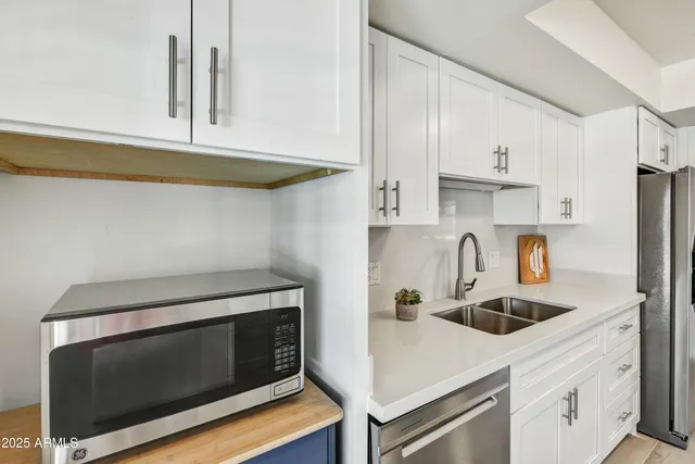 a kitchen with a stove and a microwave