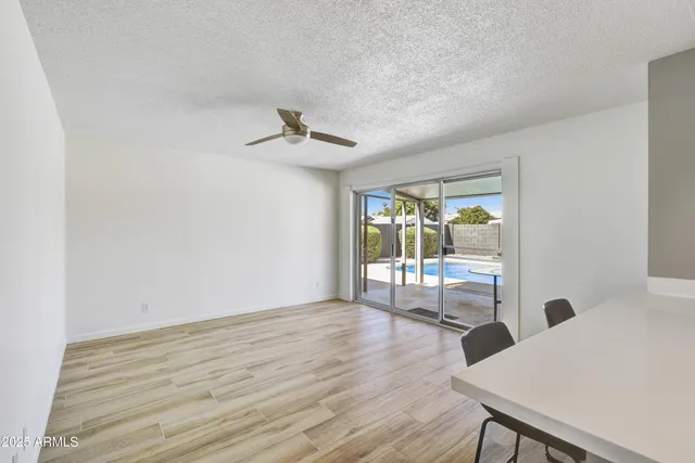 a view of a livingroom with a furniture wooden floor and a window
