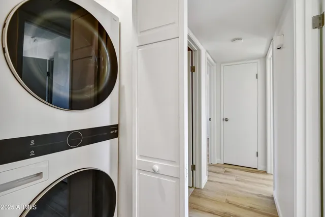 a view of a hallway with washer and dryer