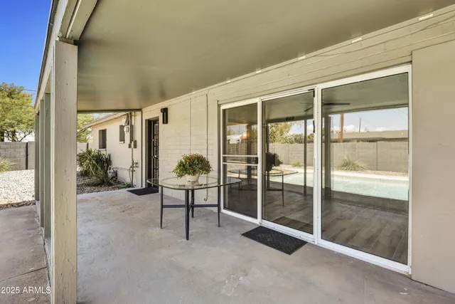 a view of an empty room and floor to ceiling window