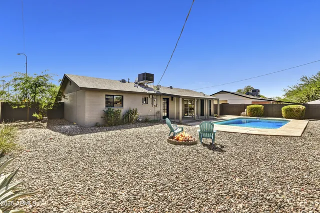 a front view of a house with sitting area