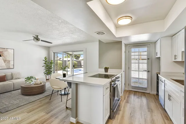 a kitchen that has a sink and a stove