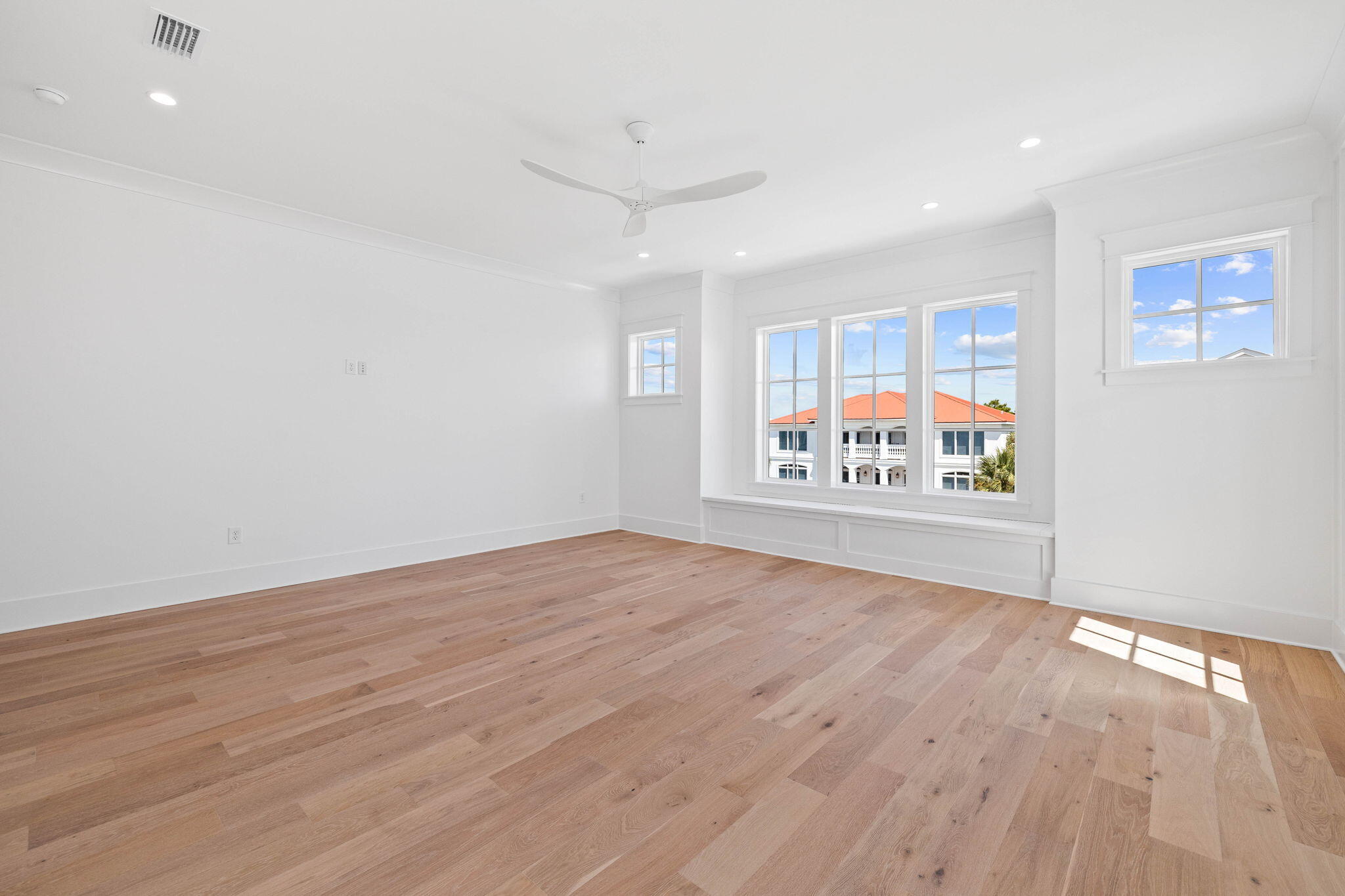 43 Pompano Street Inlet Beach, FL 32461 - Photo 31 of 83 an empty room with wooden floor and windows