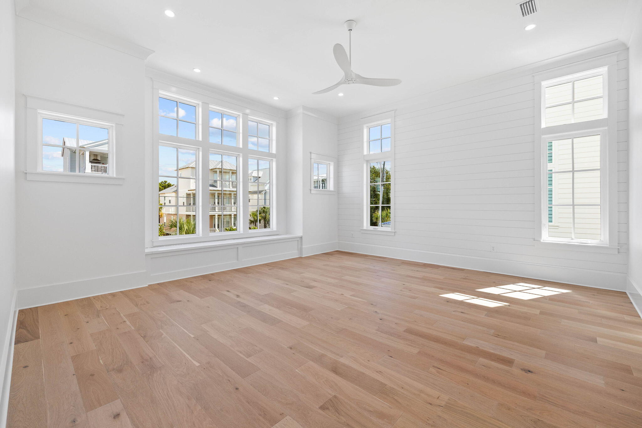 43 Pompano Street Inlet Beach, FL 32461 - Photo 54 of 83 a view of an empty room with a window and wooden floor