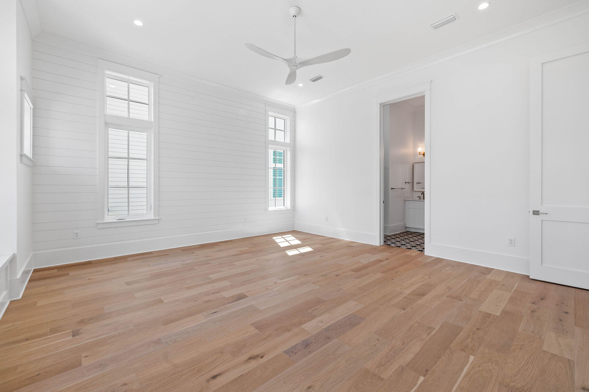 43 Pompano Street Inlet Beach, FL 32461 - Photo 55 of 83 an empty room with wooden floor and windows