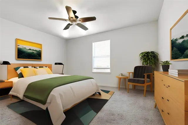 an empty room with ceiling fan and window