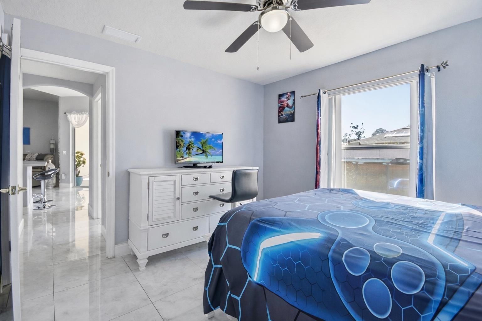 41 Botany Lane Palm Coast, FL 32137 - Photo 19 of 31 a bedroom with a bed and a chandelier