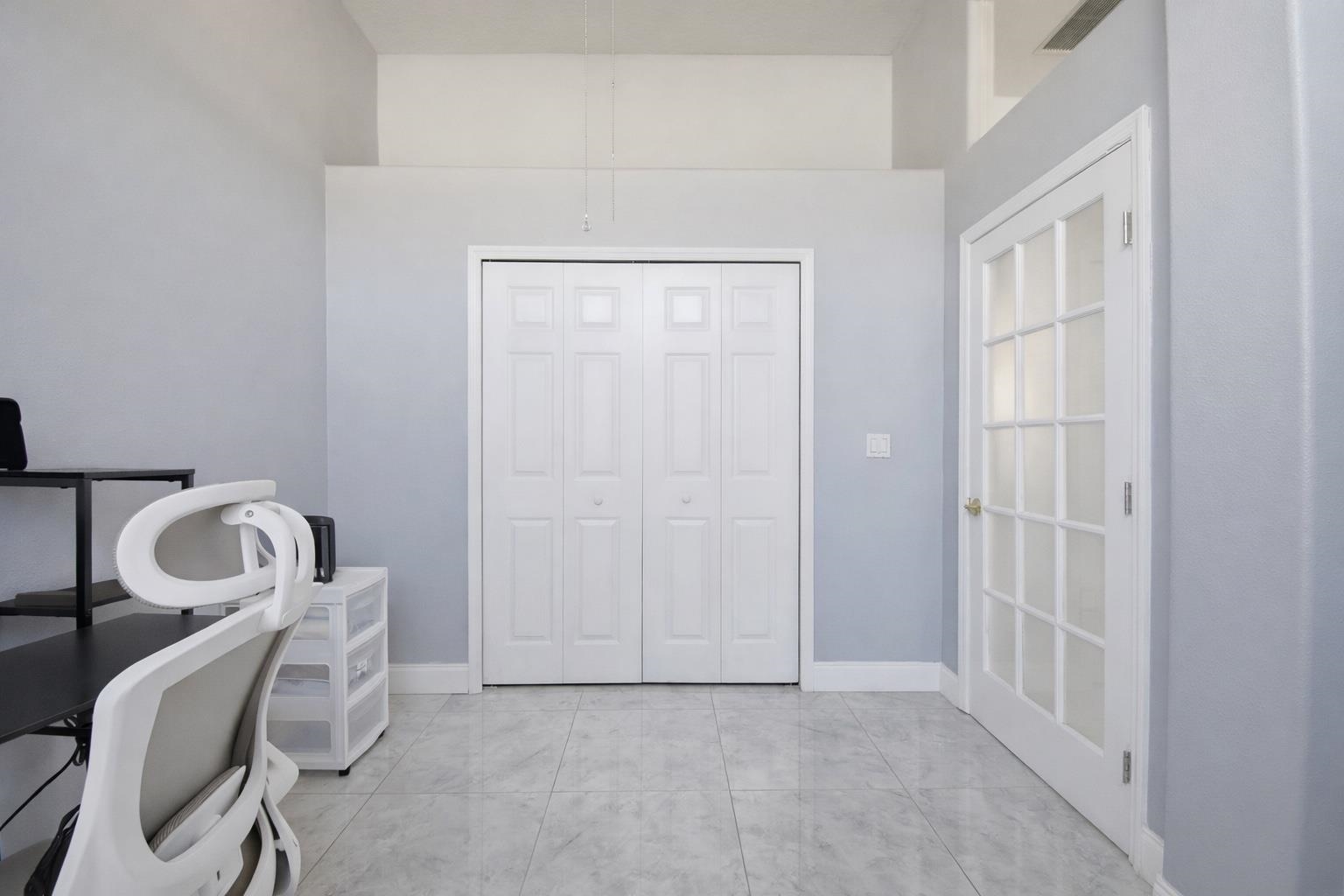 41 Botany Lane Palm Coast, FL 32137 - Photo 21 of 31 Office area featuring baseboards and a high ceiling