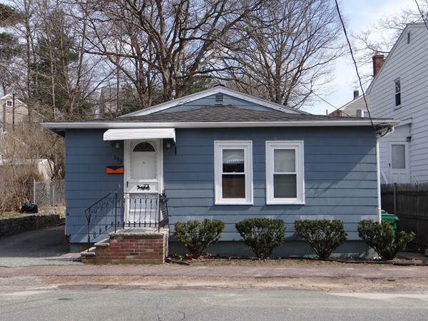 159 Sturges Street Medford, MA 02155 - Photo 1 of 12 a front view of a house with a yard