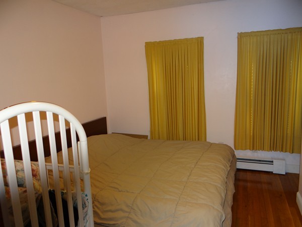 159 Sturges Street Medford, MA 02155 - Photo 7 of 12 a bedroom with a bed and a window