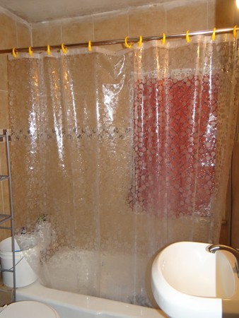 159 Sturges Street Medford, MA 02155 - Photo 9 of 12 a bathroom with a shower curtain and sink