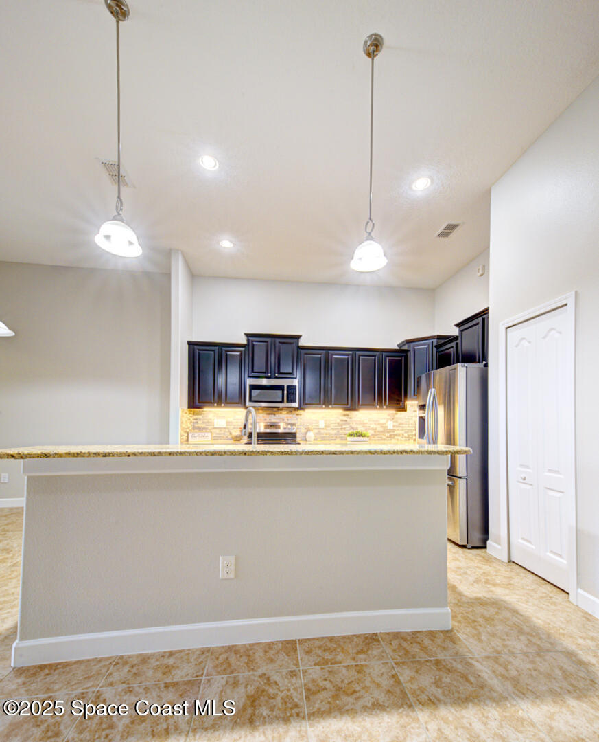 3352 Russ Place Melbourne, FL 32940 - Photo 14 of 67 kitchen breakfast bar