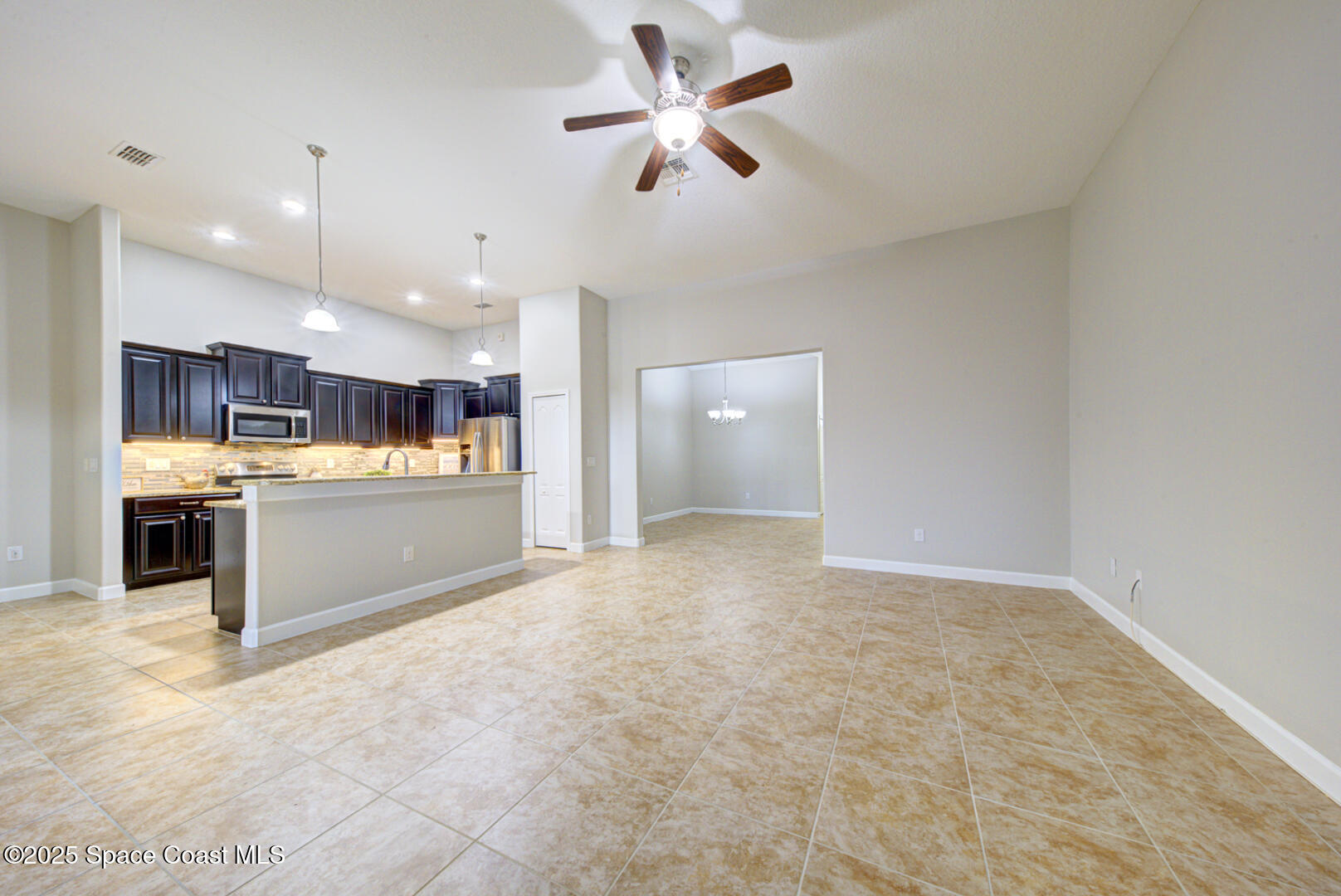 3352 Russ Place Melbourne, FL 32940 - Photo 15 of 67 a view of a kitchen with a sink and a stove top oven