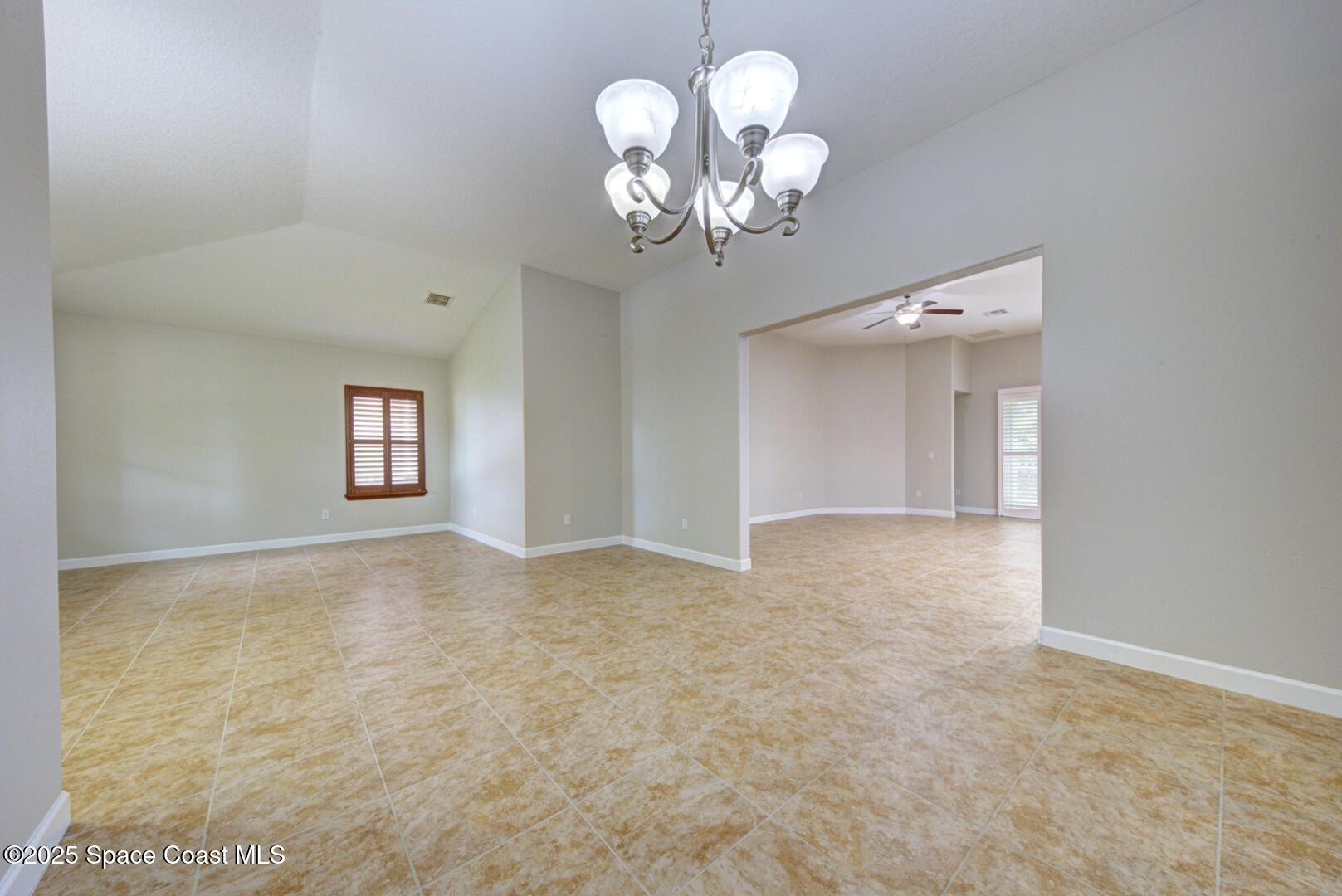 3352 Russ Place Melbourne, FL 32940 - Photo 25 of 67 a view of a chandelier fan and fire place