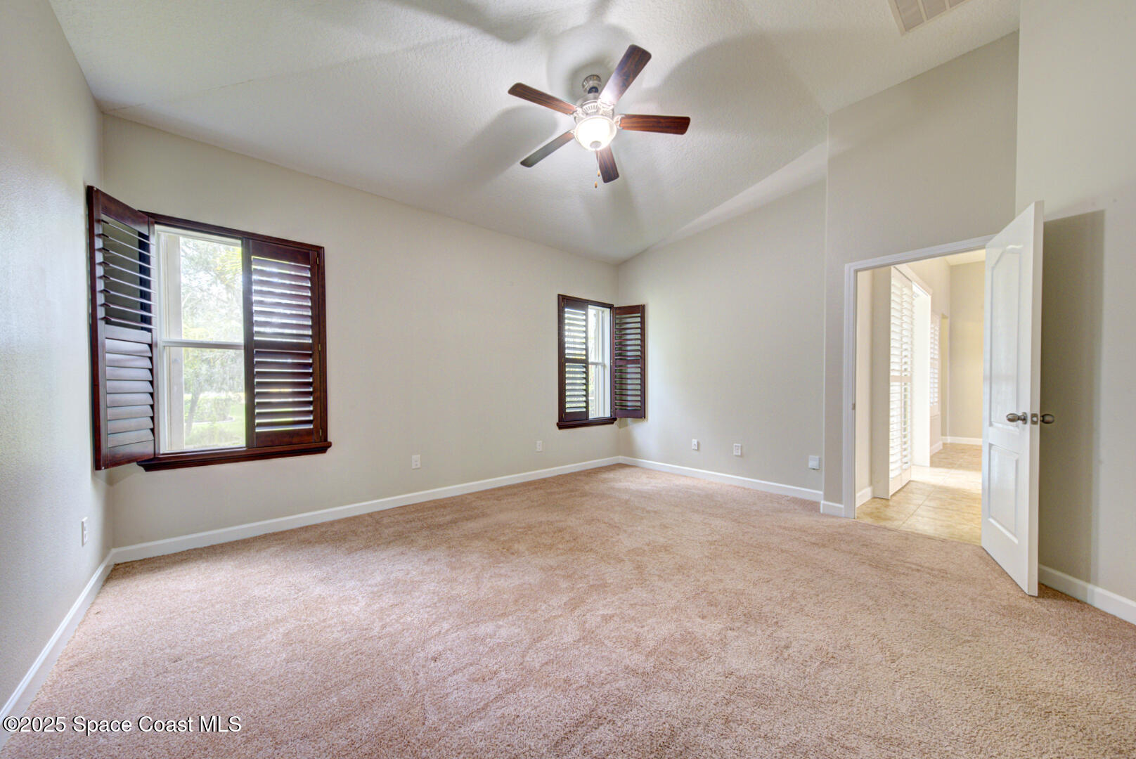 3352 Russ Place Melbourne, FL 32940 - Photo 28 of 67 an empty room with windows and fan