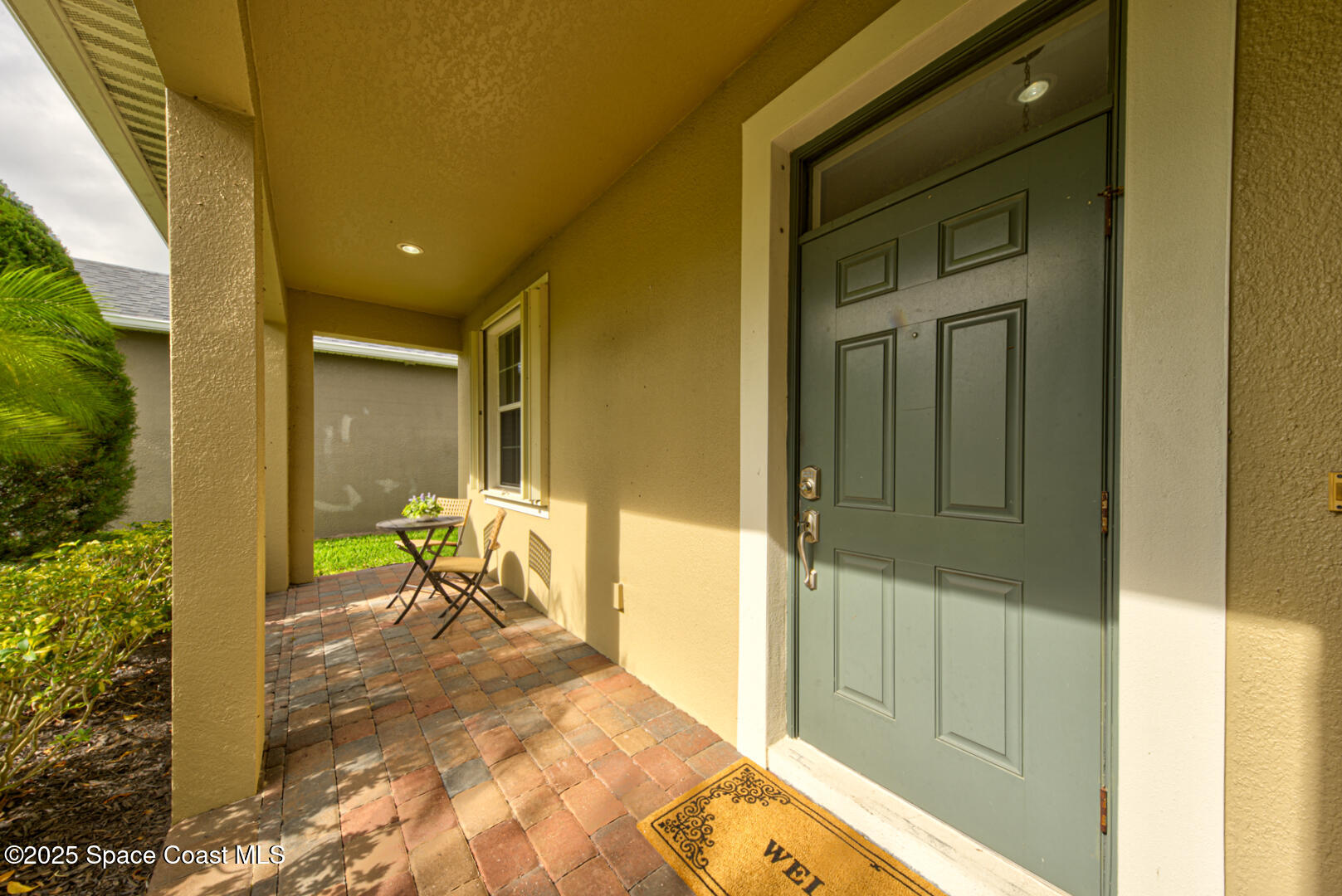 3352 Russ Place Melbourne, FL 32940 - Photo 3 of 67 a view of a porch with a table and chairs