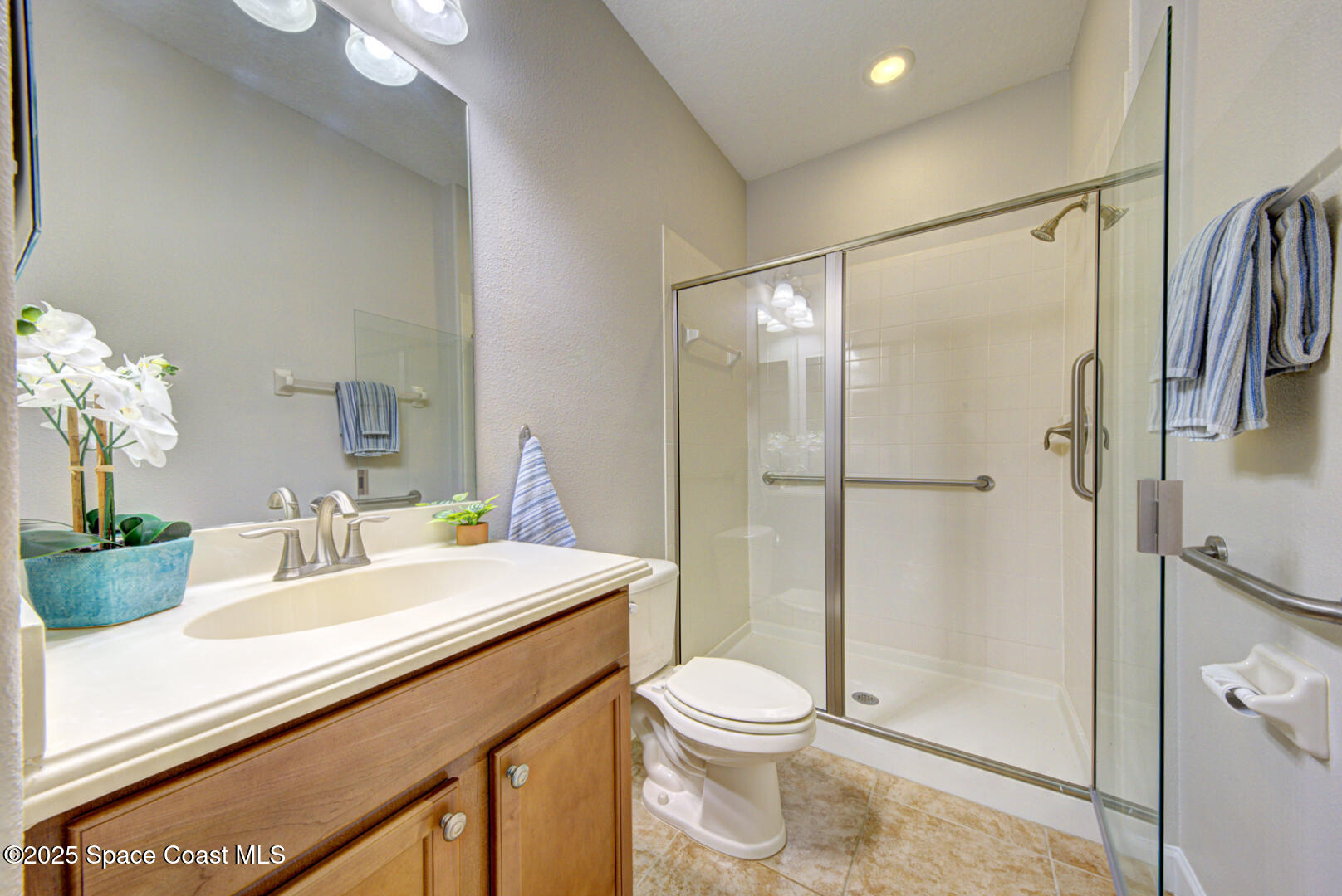 3352 Russ Place Melbourne, FL 32940 - Photo 42 of 67 a bathroom with a sink a toilet and shower