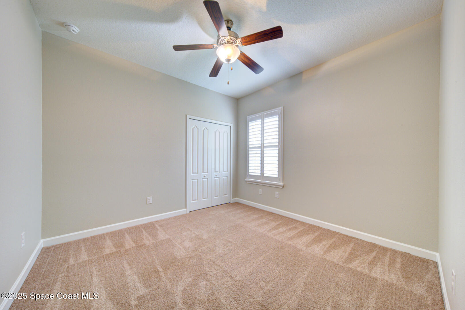 3352 Russ Place Melbourne, FL 32940 - Photo 44 of 67 wooden floor in an empty room with a window
