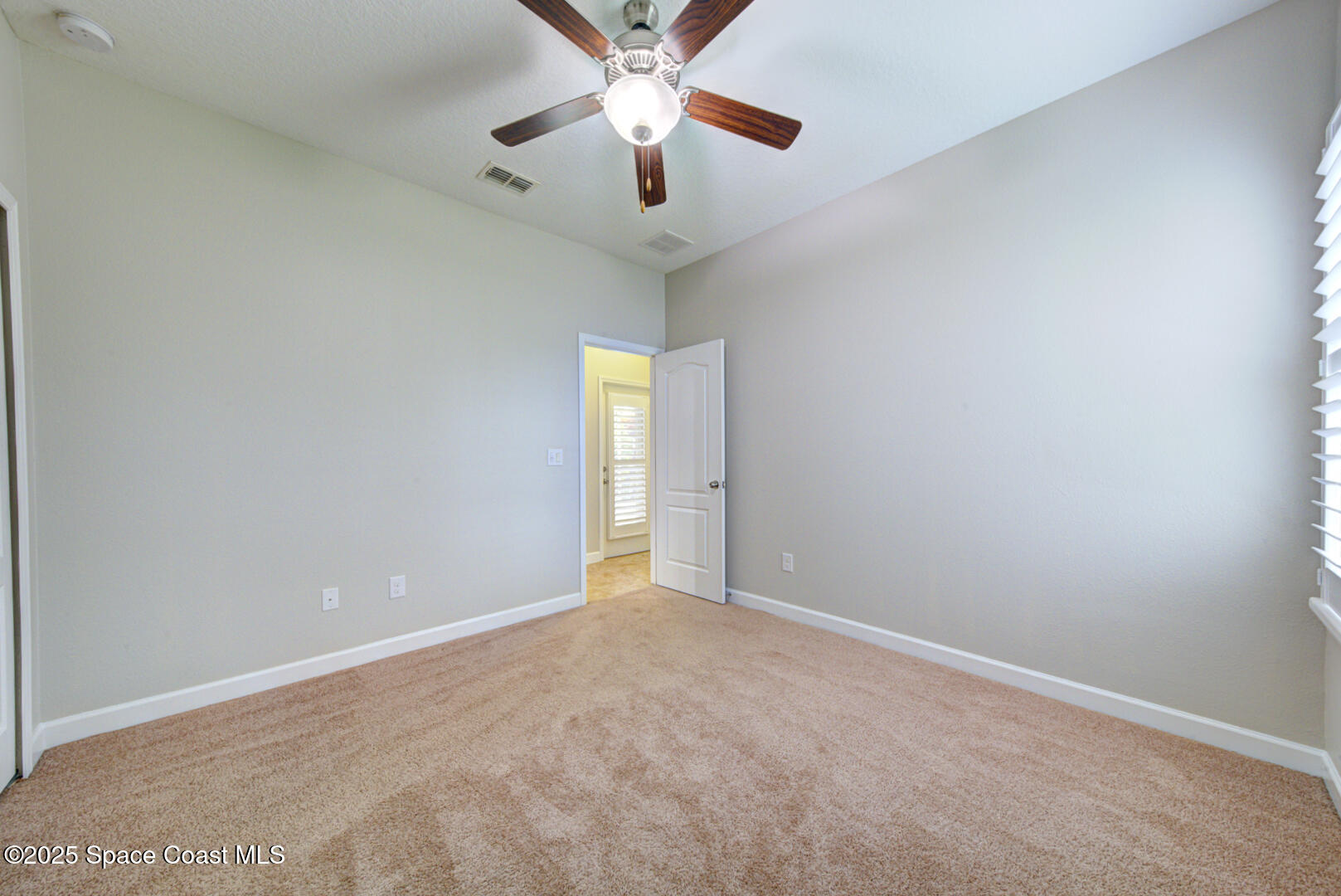 3352 Russ Place Melbourne, FL 32940 - Photo 48 of 67 a view of an empty room and chandelier fan
