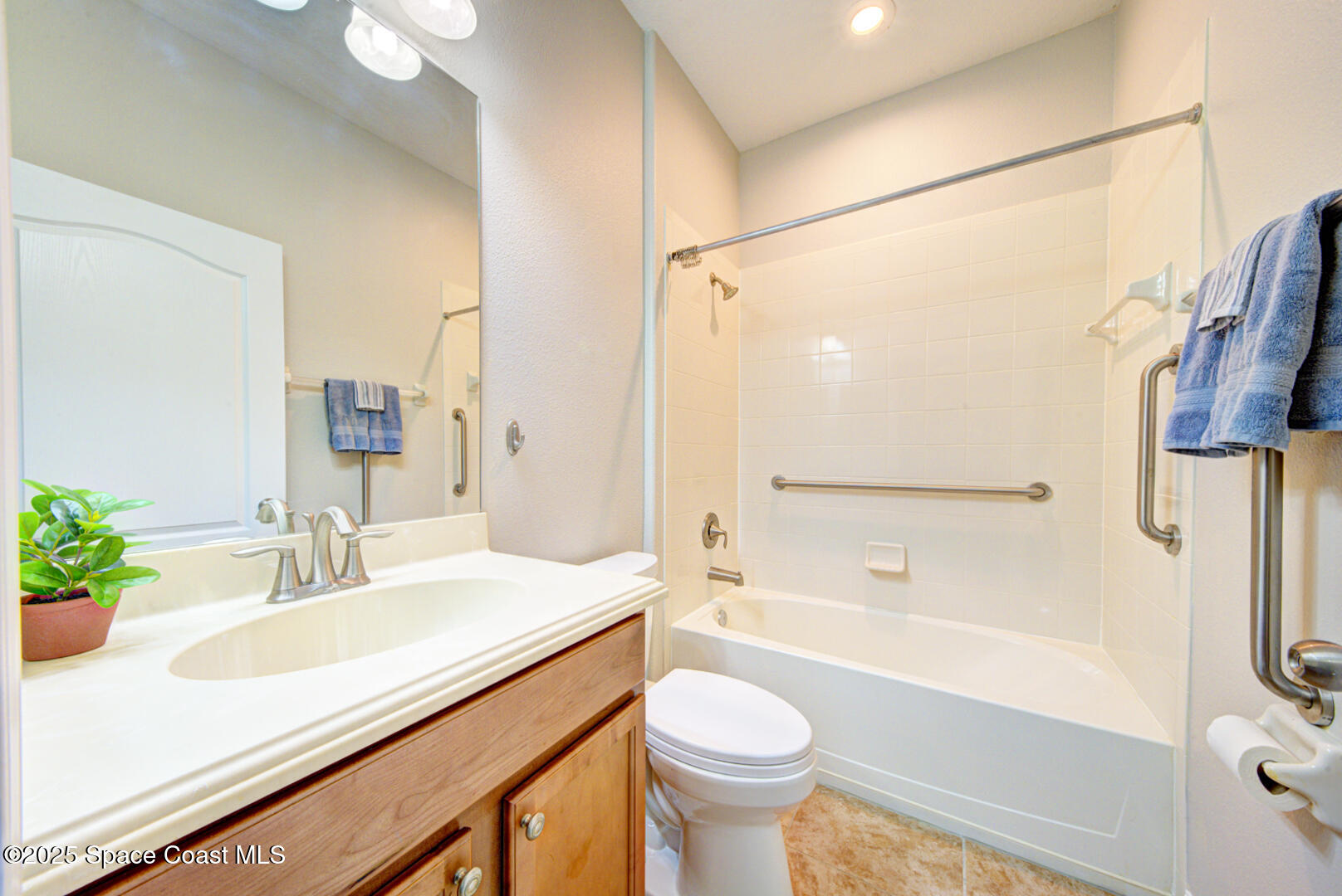3352 Russ Place Melbourne, FL 32940 - Photo 49 of 67 a bathroom with a sink a toilet and a bathtub