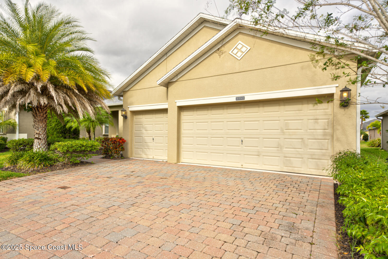 3352 Russ Place Melbourne, FL 32940 - Photo 57 of 67 a front view of a house with a yard and garage